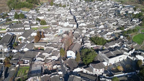 Xidi, China: Aerial drone footage of the narrow street of the traditional Xidi ancient village famous for its Hui architecture near Huangshan in Anhui province in China. 