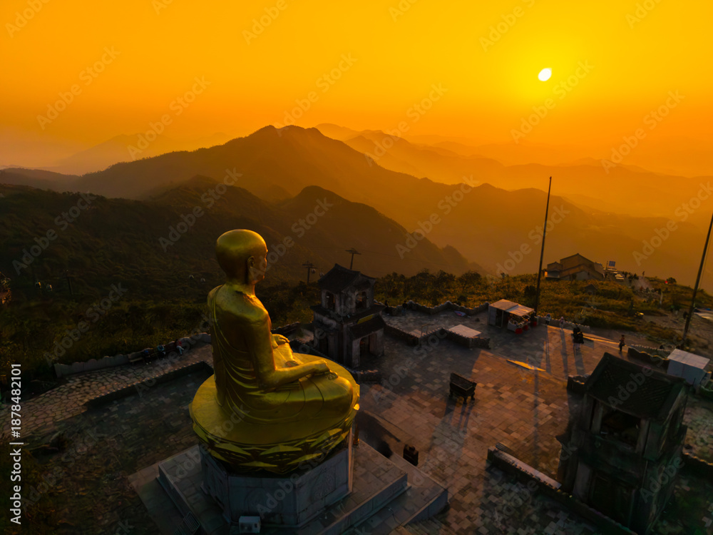 custom made wallpaper toronto digitalView of Golden statue of Buddha sitting in a lotus flower at ancient Buddhist complex at Yen Tu Mountain, Quang Ninh Province, Vietnam