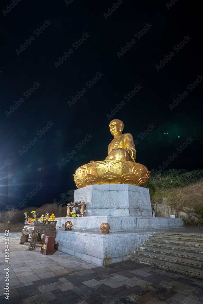 custom made wallpaper toronto digitalView of Golden statue of Buddha sitting in a lotus flower at ancient Buddhist complex at Yen Tu Mountain, Quang Ninh Province, Vietnam