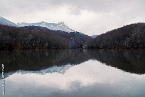 Perfect reflection of a lake with forest and mountains Lake in Montseny