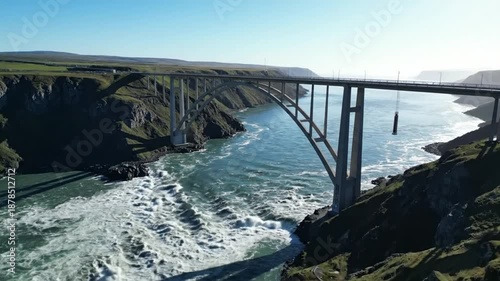 Wallpaper Mural Scenic aerial view of a majestic arched bridge over a powerful river with a bungee jump platform in Iceland Torontodigital.ca