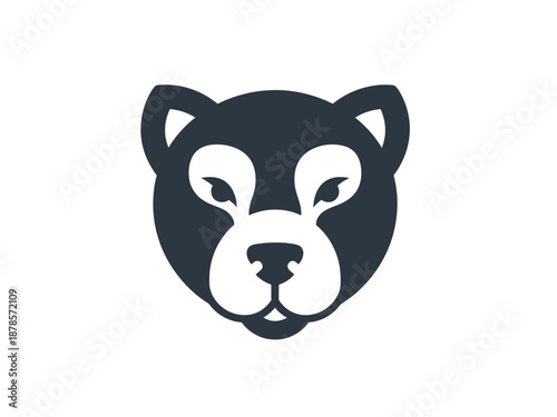 Stylized dark silhouette of a friendlylooking mammal face on a white background