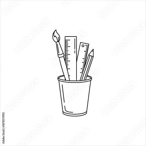 a cup with a paintbrush ruler and pencil inside