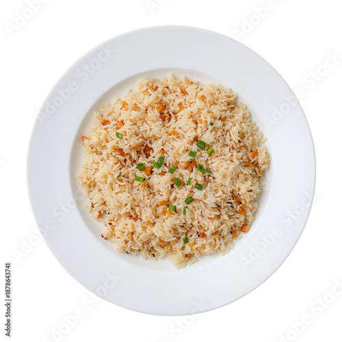 Rice Dish Served on a White Plate With Green Garnish at a Kitchen Table in Da...