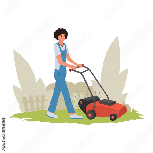 Male gardener mows the lawn in a backyard on a sunny day while wearing overalls and pushing a lawnmower