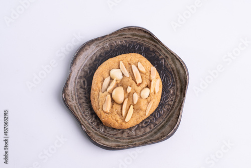 soft cookies with almond macadamia and chocolate on a table and plate