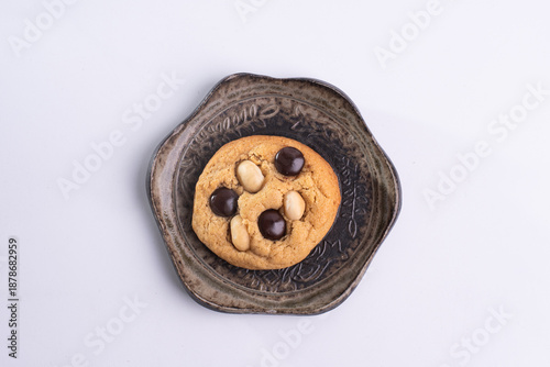 soft cookies with almond macadamia and chocolate on a table and plate