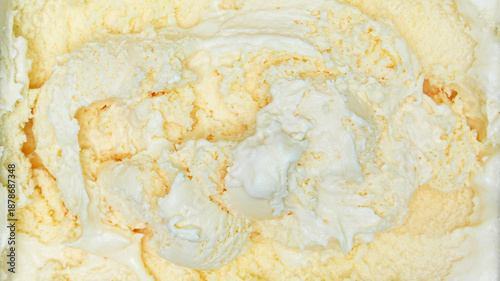 Creamy close-up vanilla ice cream rich texture and soft swirls.