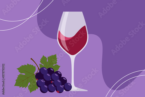 A glass of red wine next to a bunch of fresh purple grapes with a green leaf on a purple background.