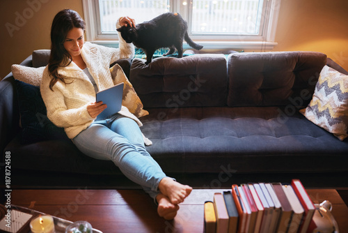 Bild auf Leinwand Relax, tablet and woman with cat on couch for news article, social media or communication in living room