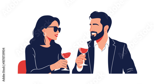Romantic couple sitting at a table and enjoying a date with glasses of red wine while talking and smiling at each other.