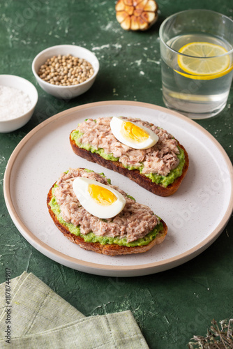 Bruschetta with tuna, avocado and egg. Healthy eating. Breakfast.