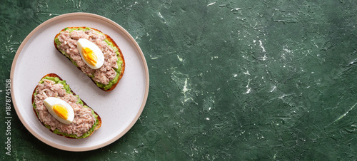 Bruschetta with tuna, avocado and egg. Healthy eating. Breakfast.