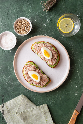 Bruschetta with tuna, avocado and egg. Healthy eating. Breakfast.