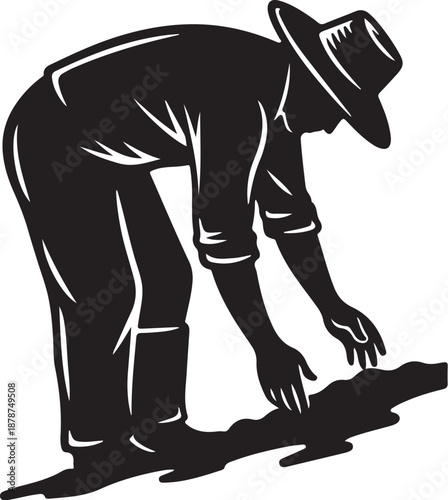 Farmer planting seeds in the soil with care and precision