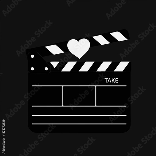 Film clapperboard with heart symbol on black background
