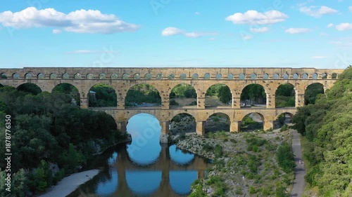 Exploring the majestic Pont du Gard aqueduct in France, discover the stunning architecture of the ancient Pont du Gard aqueduct in southern France. River Gard, Languedoc-Roussillon, France.