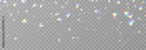 Falling holographic confetti. Shiny rainbow confetti PNG. Falling streamers or tinsel on an isolated transparent background.