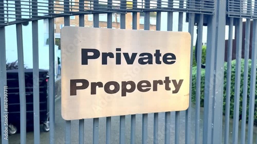 private property shiny metal sign attatched to residency metal gates