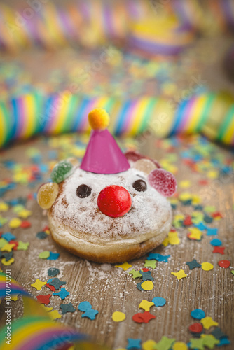 Pastry clown for carnival celebration with streamers and confetti