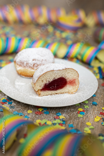 Cutted pastry for carnival celebration with streamers and confetti