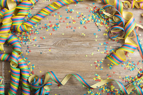 Colorful party frame with streamers and confetti