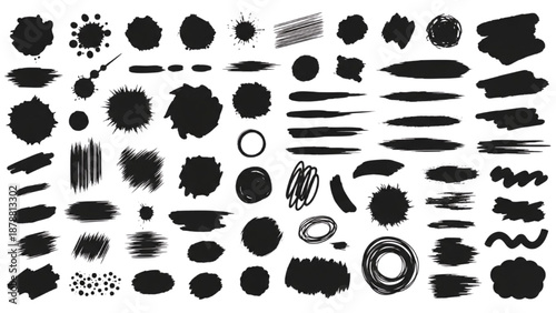 Collection of various black abstract shapes and brushstrokes on a plain background viewed from directly above