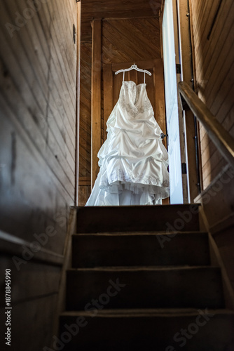 White Wedding Dress at the Top of the Staircase