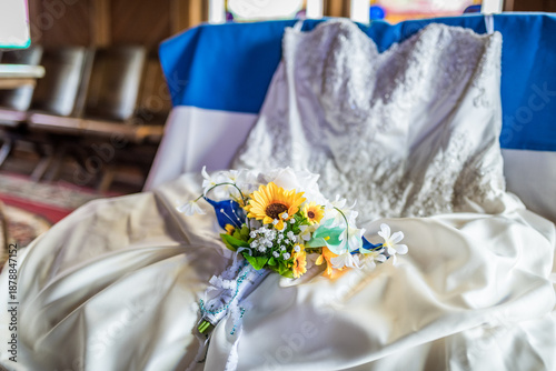 Yellow and Blue Bouquet on Bridal Gown in the Church