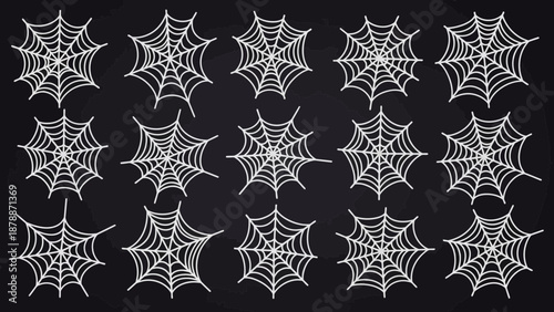 Array of decorative spiderwebs on a stark black backdrop evokes spooky Halloween spirit