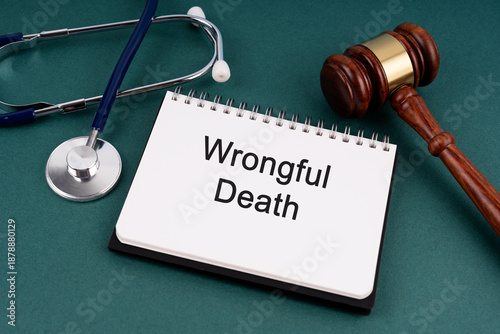 High angle view of Gavel and Wrongful Death text on a Notebook
