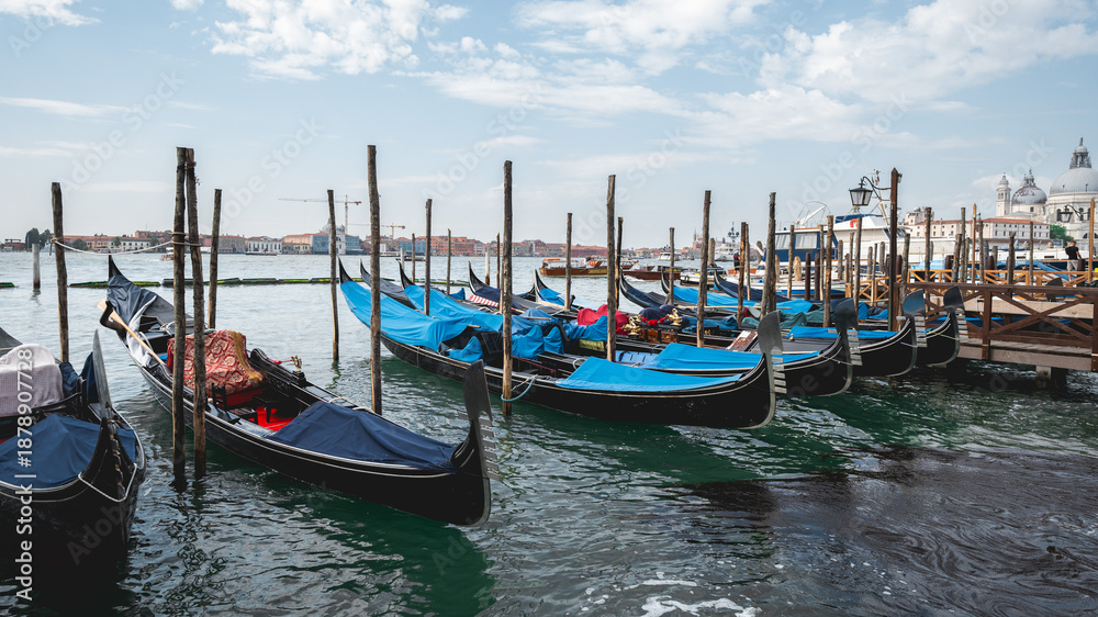 Fototapeta premium Gondolas Moored Along Venetian Waterfront