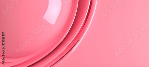 Pink glossy curved surface with abstract geometric shapes and reflection
