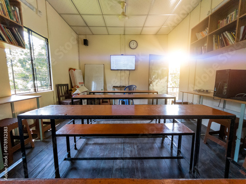 Smart Classroom with Digital Screen and Traditional Wooden Benches in Rural Bangladesh