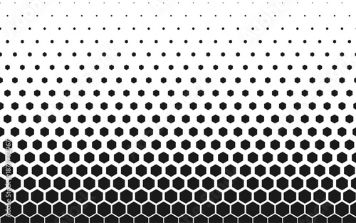 Hexagon halftone pattern fading vertically in black and white