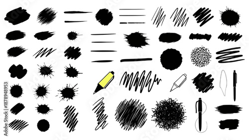 Collection of various black brush strokes and pencil marks on white background viewed from directly above