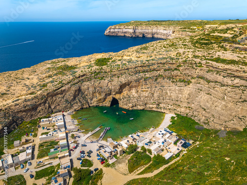 The Inland Sea, Dwejra is a lagoon of seawater on the island of Gozo. Aerial view of Sea Tunnel near Azure window. Malta 