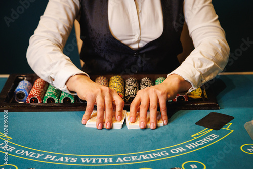 Casino Dealer Dealing Cards at Poker Table with Chips