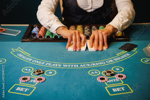 Konstfotografi Casino Dealer Dealing Cards at Poker Table with Chips