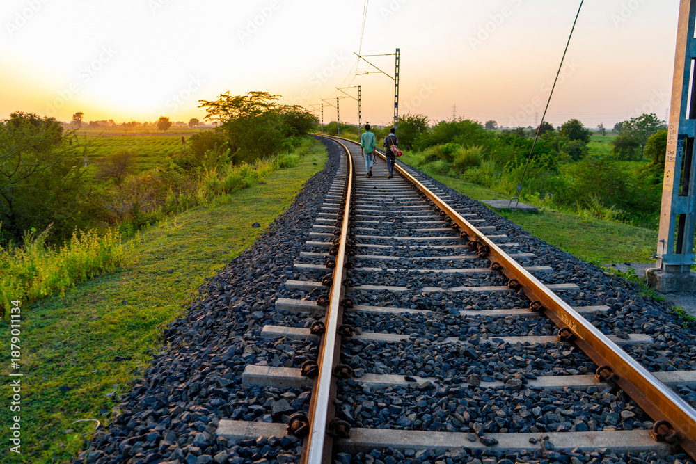 Obraz premium Landscape of railroad tracks in India cutting across rural countryside