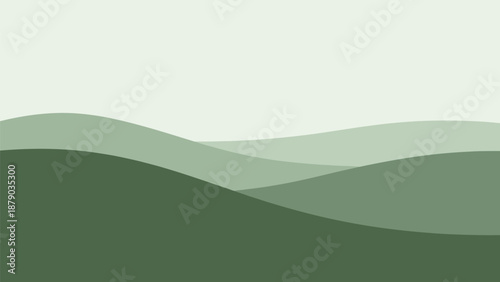 Soothing green hills landscape with gentle waves and white sky