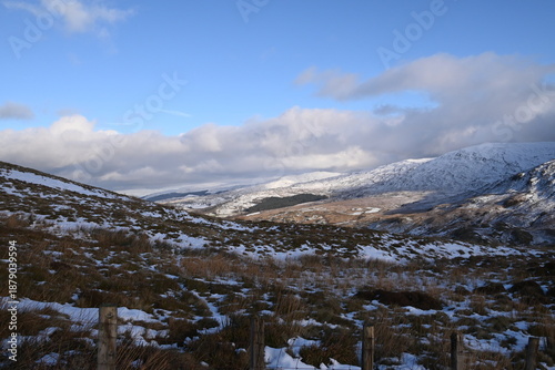 a view walking up a snowy Cadair Idris in south Gwynedd, wales from the mach loop
