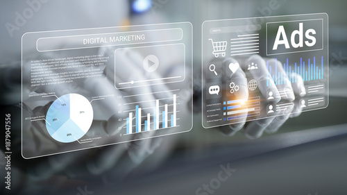 Fotografie This image showcases hands interacting with digital marketing visuals, featuring graphs and statistics that highlight key advertising insights for online campaigns