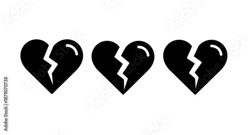 Three broken black hearts on a white background symbolizing sadness and heartbreak