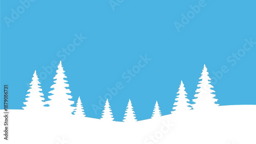 Winter landscape with snow-covered trees viewed from a low angle against a clear blue sky