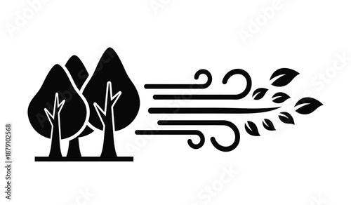 Silhouette of trees affected by strong wind gusts and falling leaves