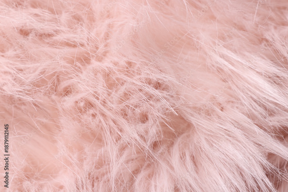 Obraz premium Texture of pink fluffy fabric as background, closeup