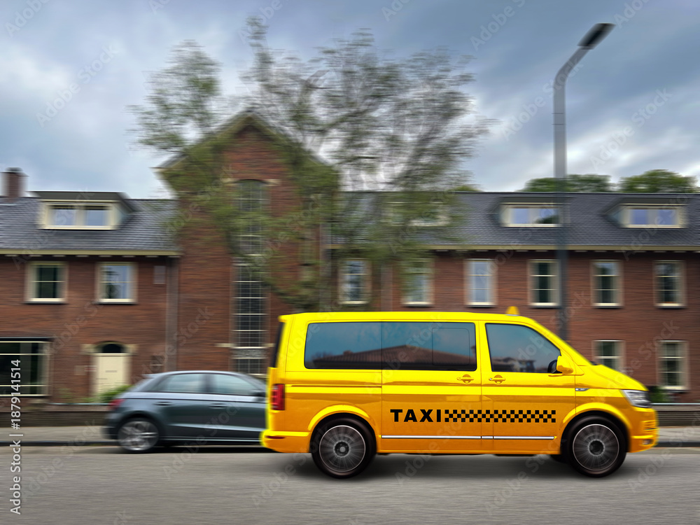 Fototapeta premium Yellow taxi car driving on city street, motion blur