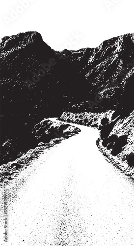 Snowy mountain pass with a winding road through rugged peaks in monochrome.
