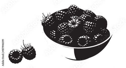 Assorted blackberries in a ceramic bowl with loose berries nearby.